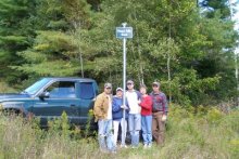 Family at road sign.